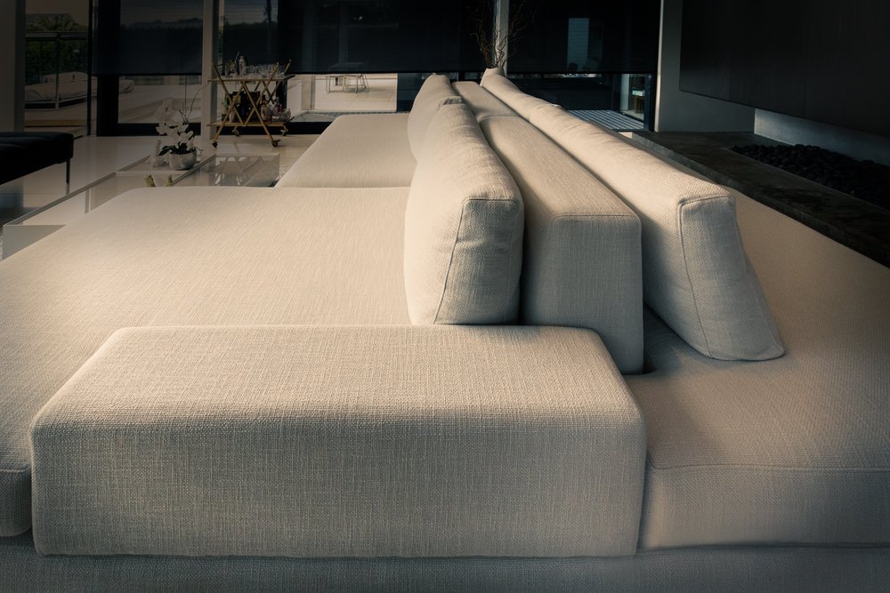 Close view of the custom double-sided sofa and its central backrests.