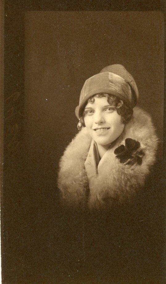 Vintage portrait of a woman wearing a fur coat and cloche hat