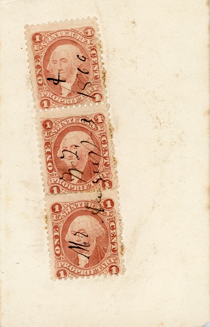 Three cancelled vintage one-cent U.S. postage stamps in a vertical row.