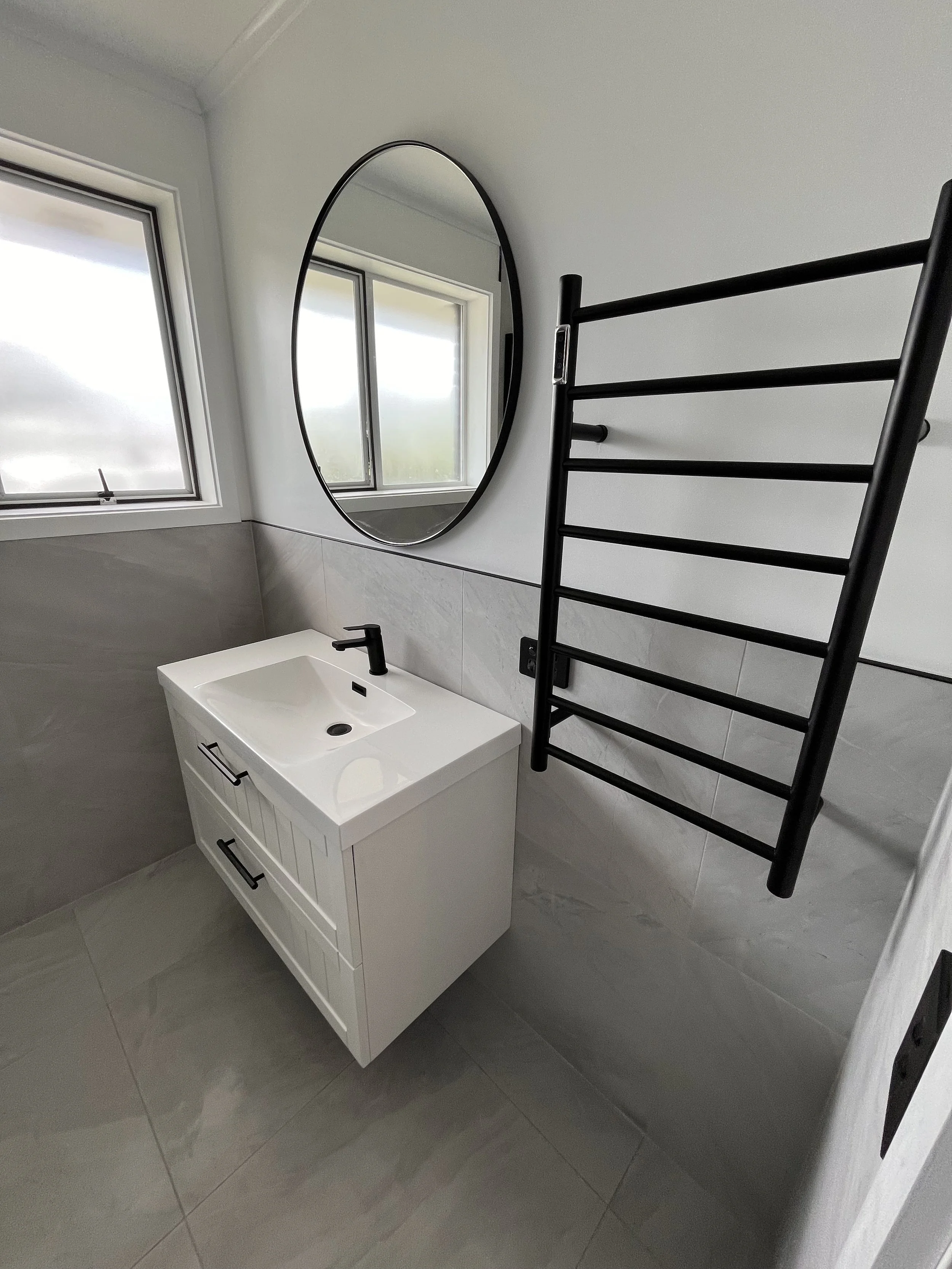 Renovated bathroom, new tiling and black fixtures