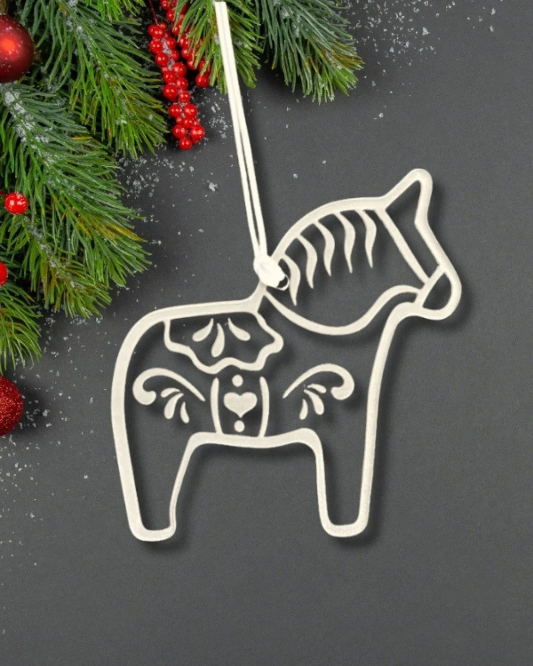 The Dala horse has long been a symbol of strength, love, and good fortune.

I wanted to take that classic symbol and give it a fresh, modern twist. Our clear acrylic laser-cut Dala horse ornament blends the beauty of tradition with the simplicity of 
