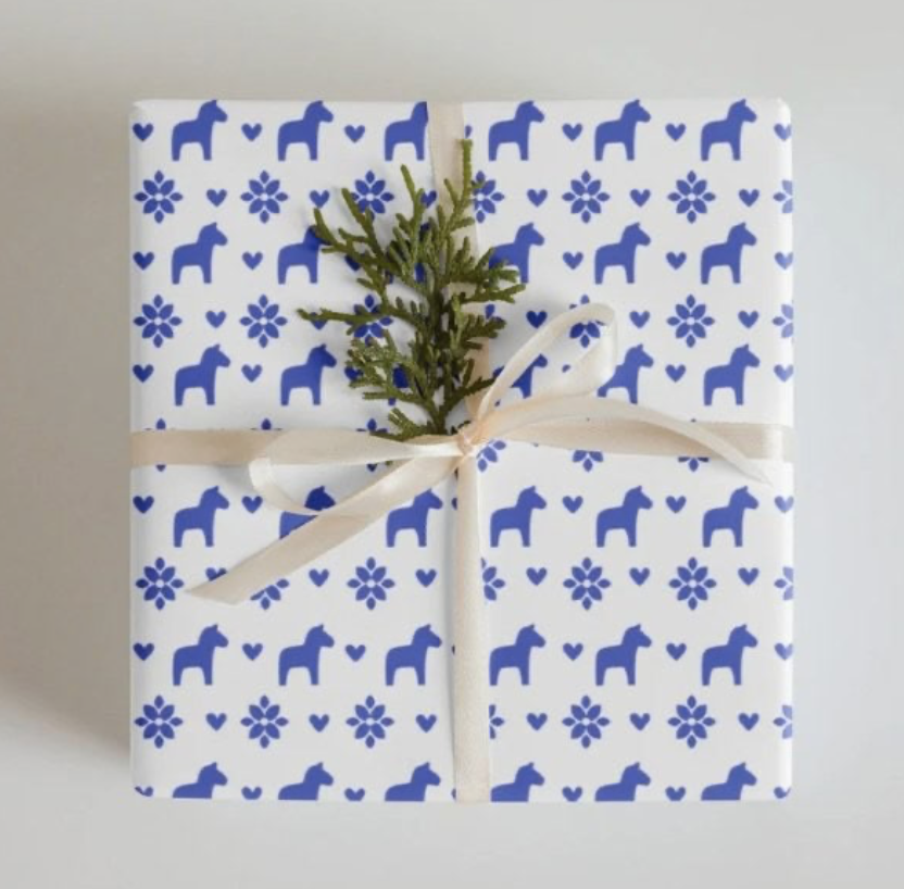 Wrap up your holiday gifts in festive folk-art style with these premium sheets adorned with iconic Swedish Dala horses in white and blue. The matte finish and quality stock make the presentation feel intentionally special. This wrapping paper is perf