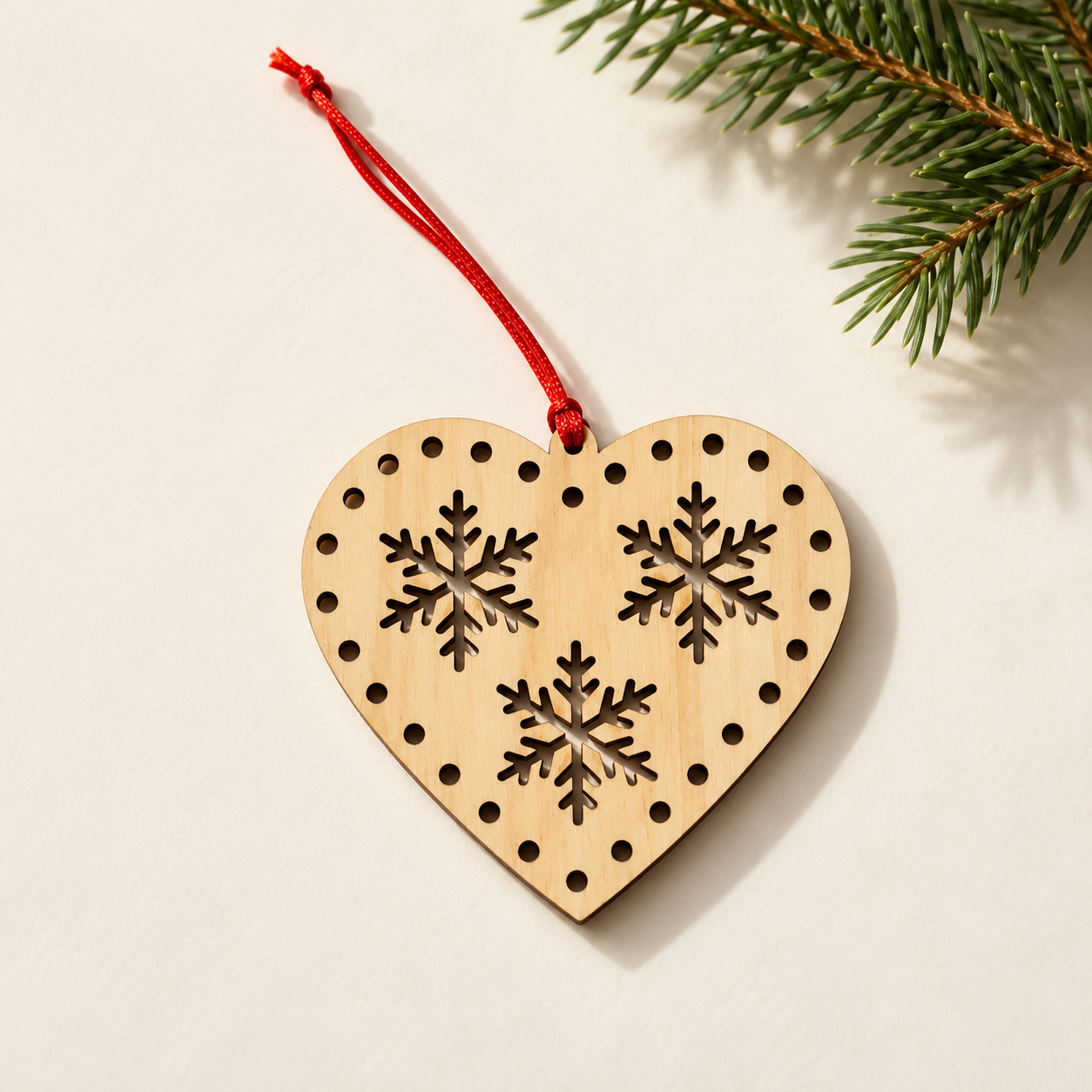 Laser-cut snowflake heart ornament.png