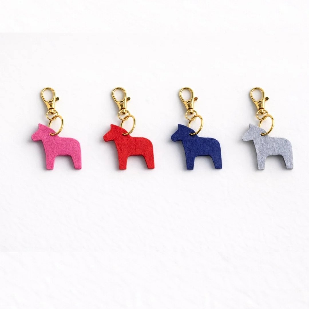 Dala+Horse+Felt+Purse+Charm+Collection+Flatlay+Pink+Red+Blue+Gray.jpg