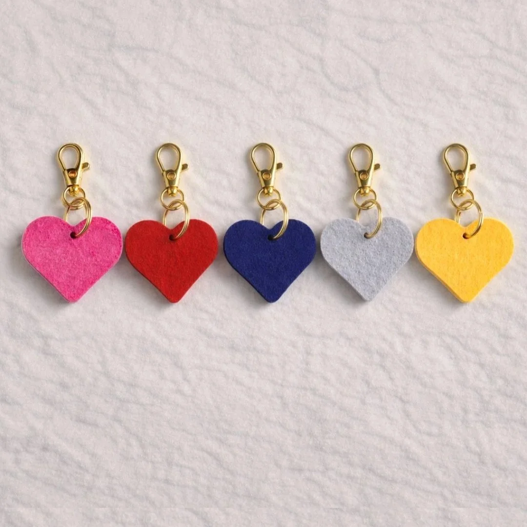 Felt+Heart+Purse+Charms+Pink+Red+Blue+Grey+and+Yellow+Flatlay.jpg