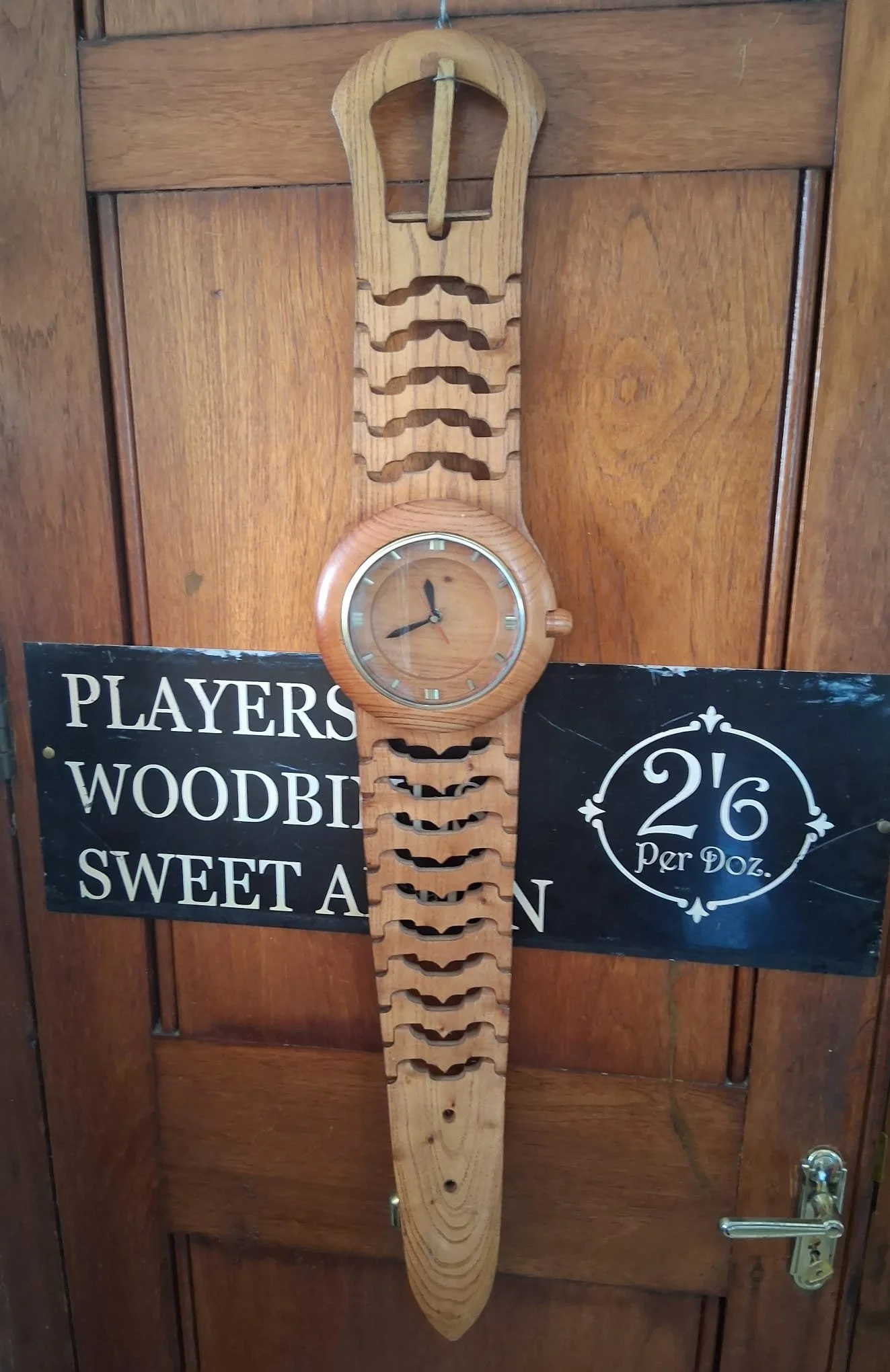 Very large novelty wall clock in the shape of a wristwatch