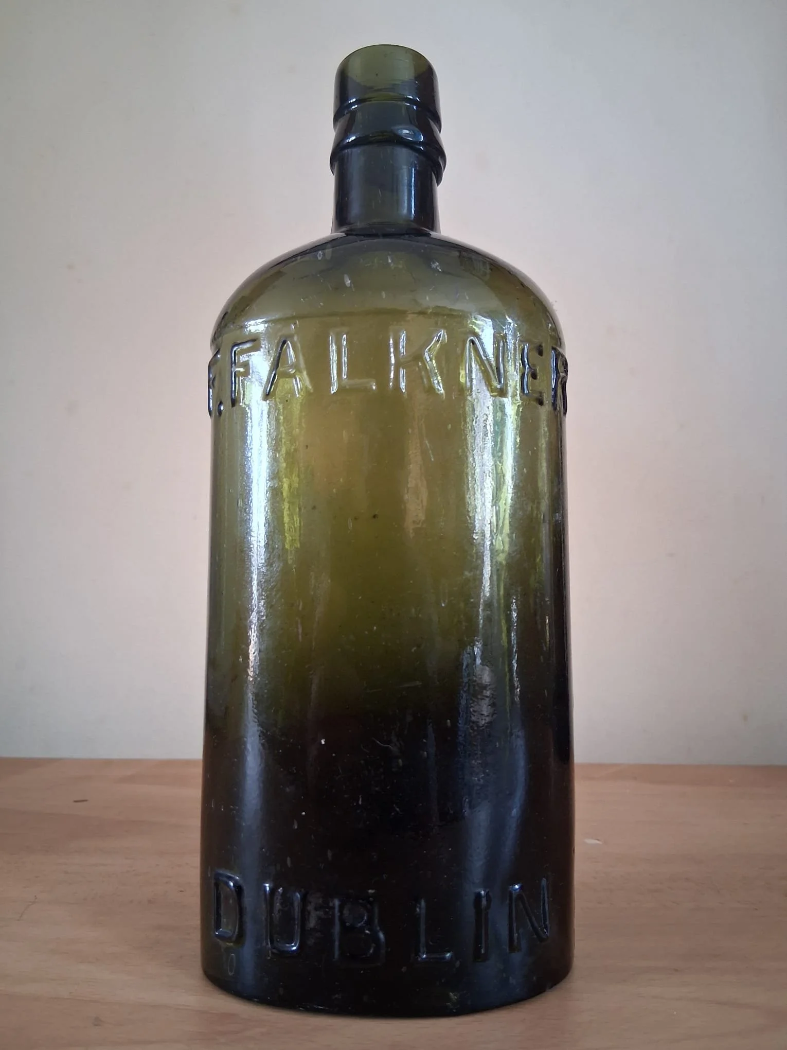 19thC Francis Falkner Black Glass Embossed Whiskey Bottle