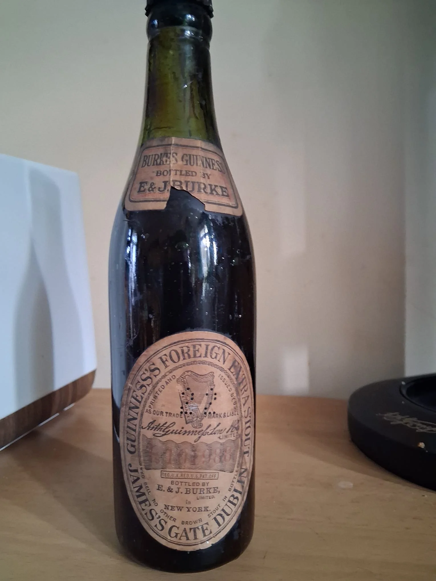 Super Rare very early 1910-dated unopened E&J Burke Guinness's Foreign Stout embossed and double labelled glass stout bottle