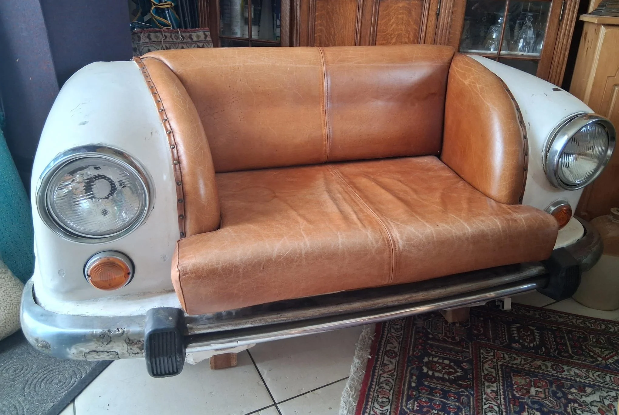 Ultra cool car coach upholstered in tan leather