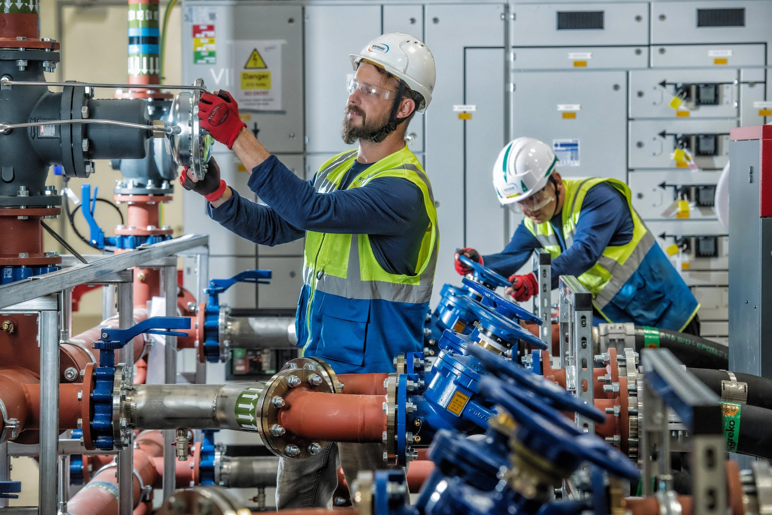 Bouygues workers operating heavy machinery during site development