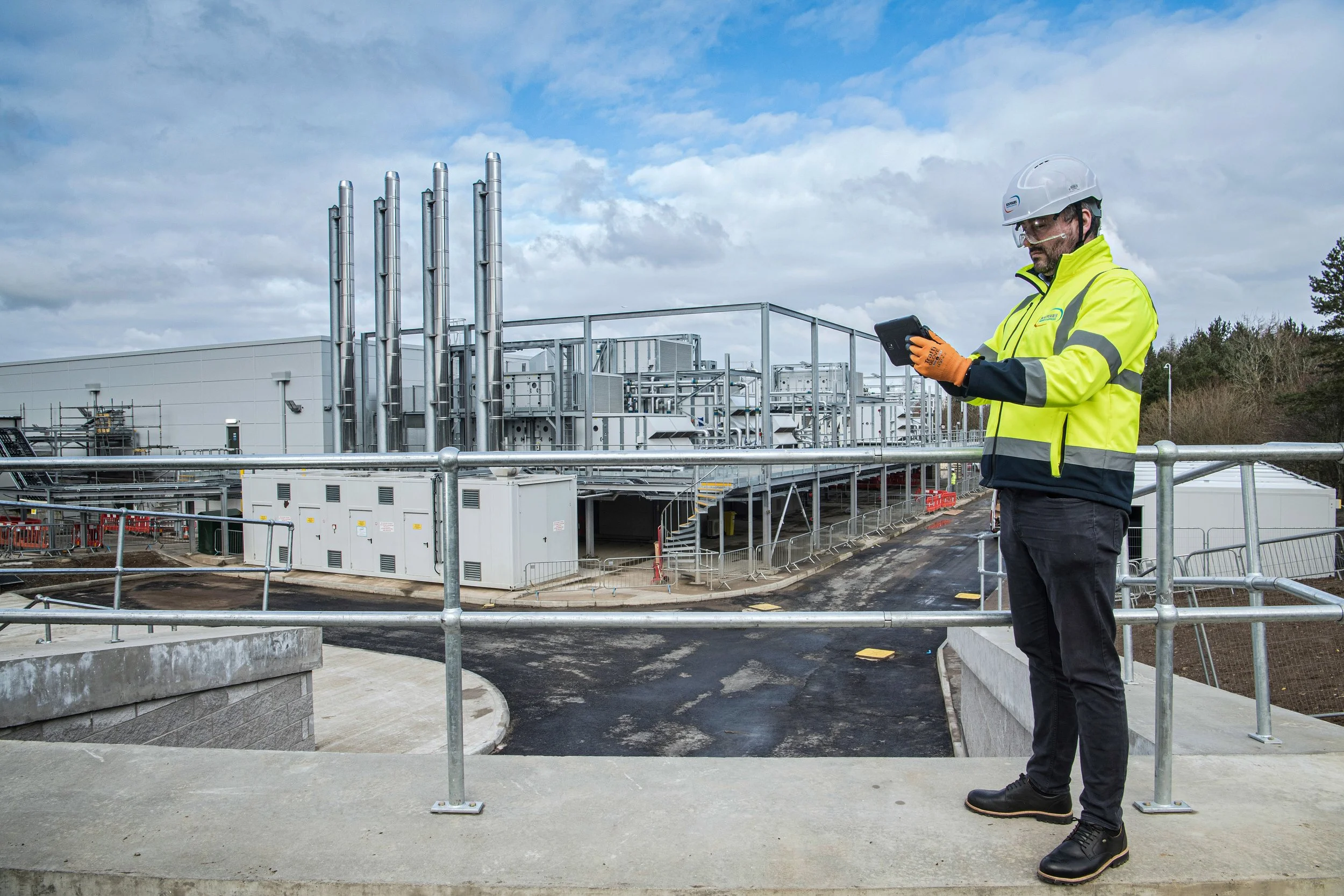 Bouygues construction workers collaborating on active building site