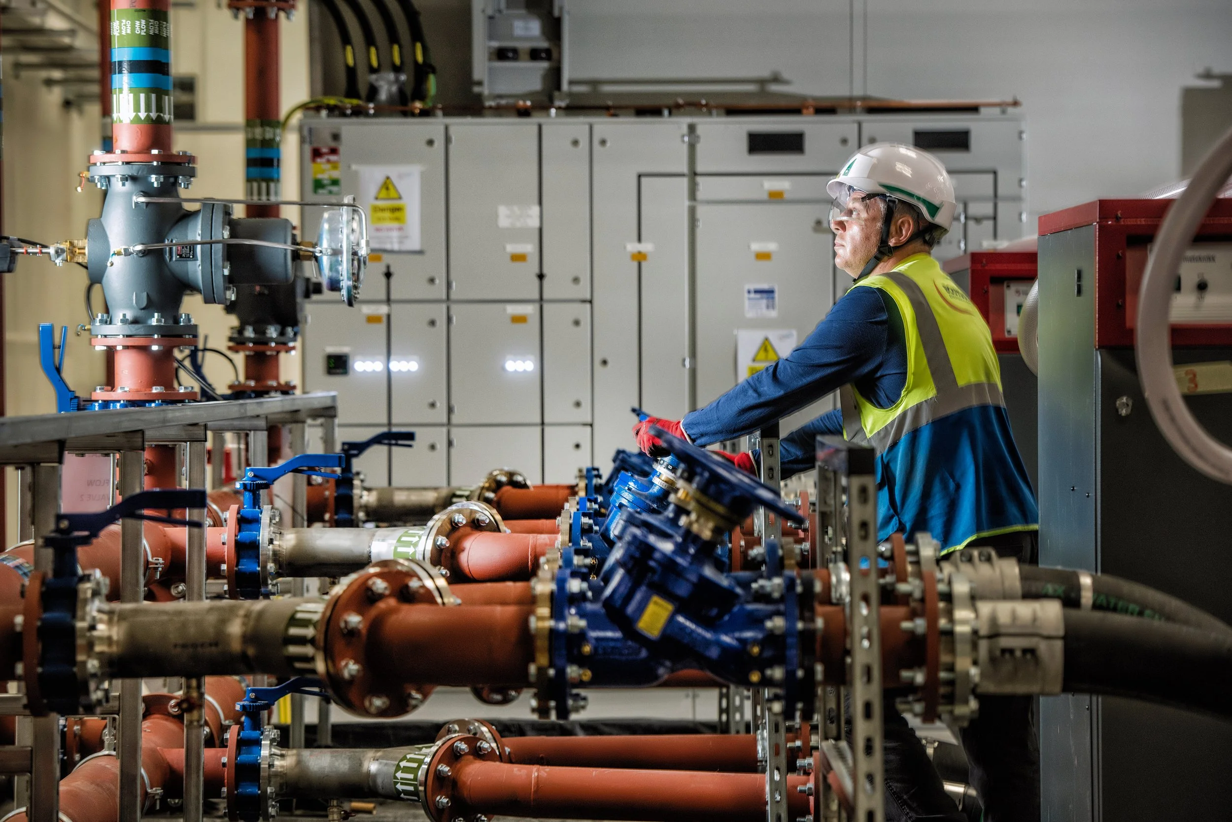 Bouygues workers handling materials and equipment on busy site