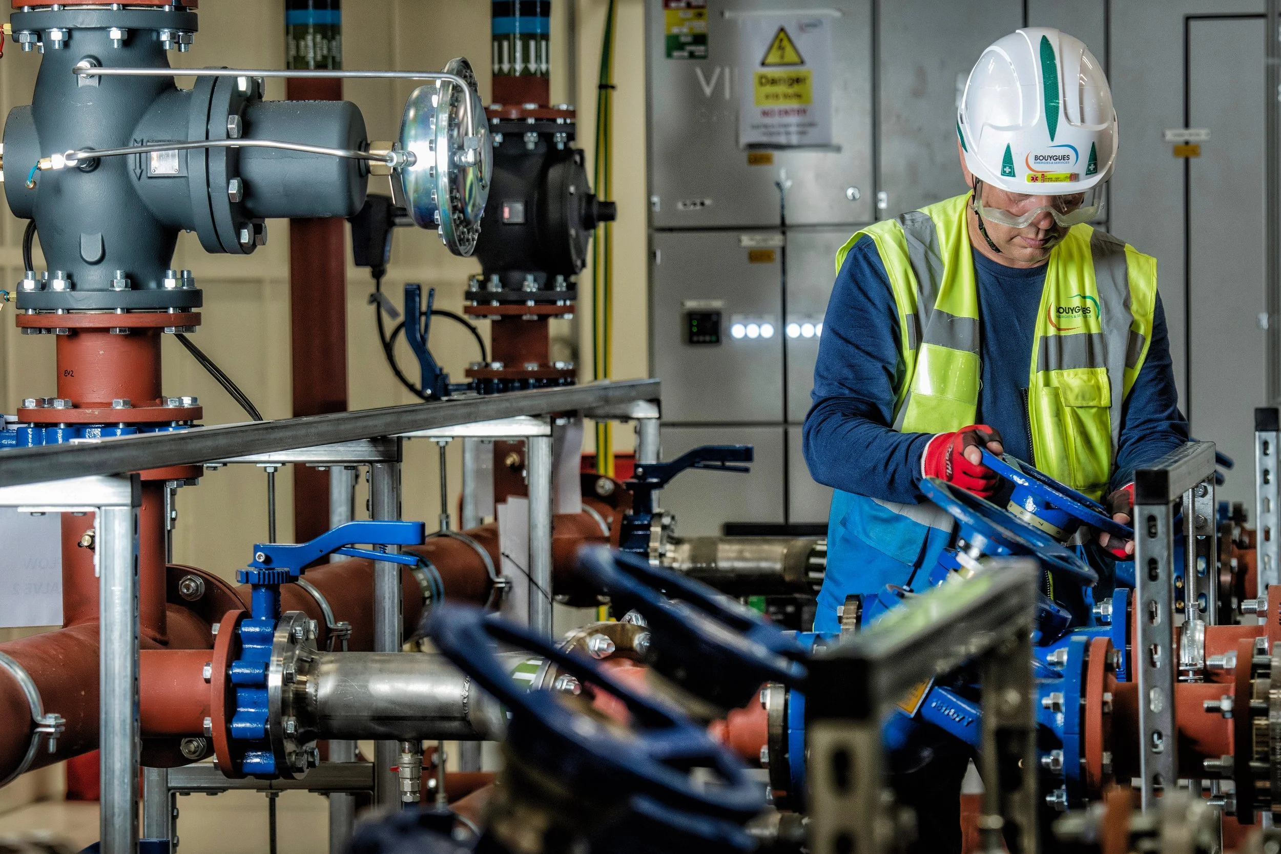 Bouygues workers assembling structural components on active building site