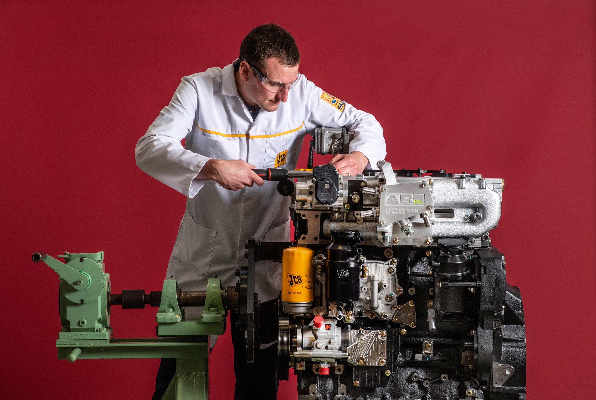 JCB hydrogen engine testing with engineers and technicians