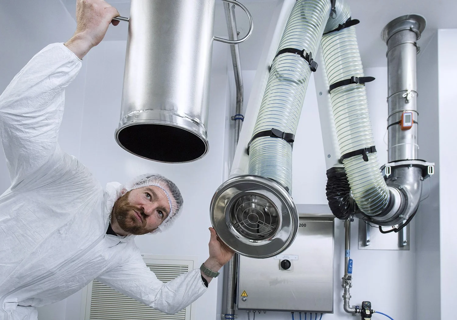 Engineers carrying out installation work in pharmaceutical manufacturing facility