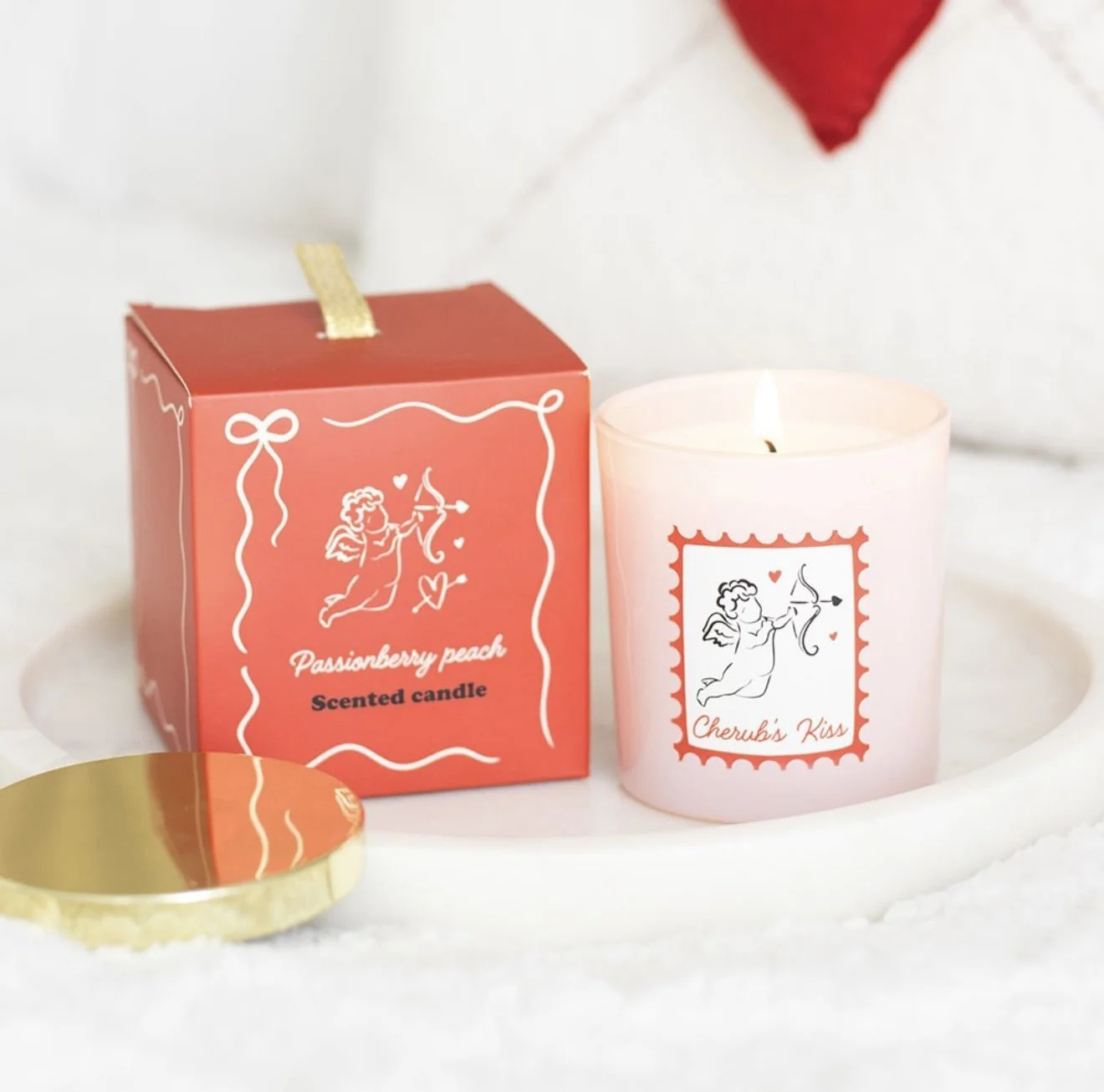 Cherubs kiss candle