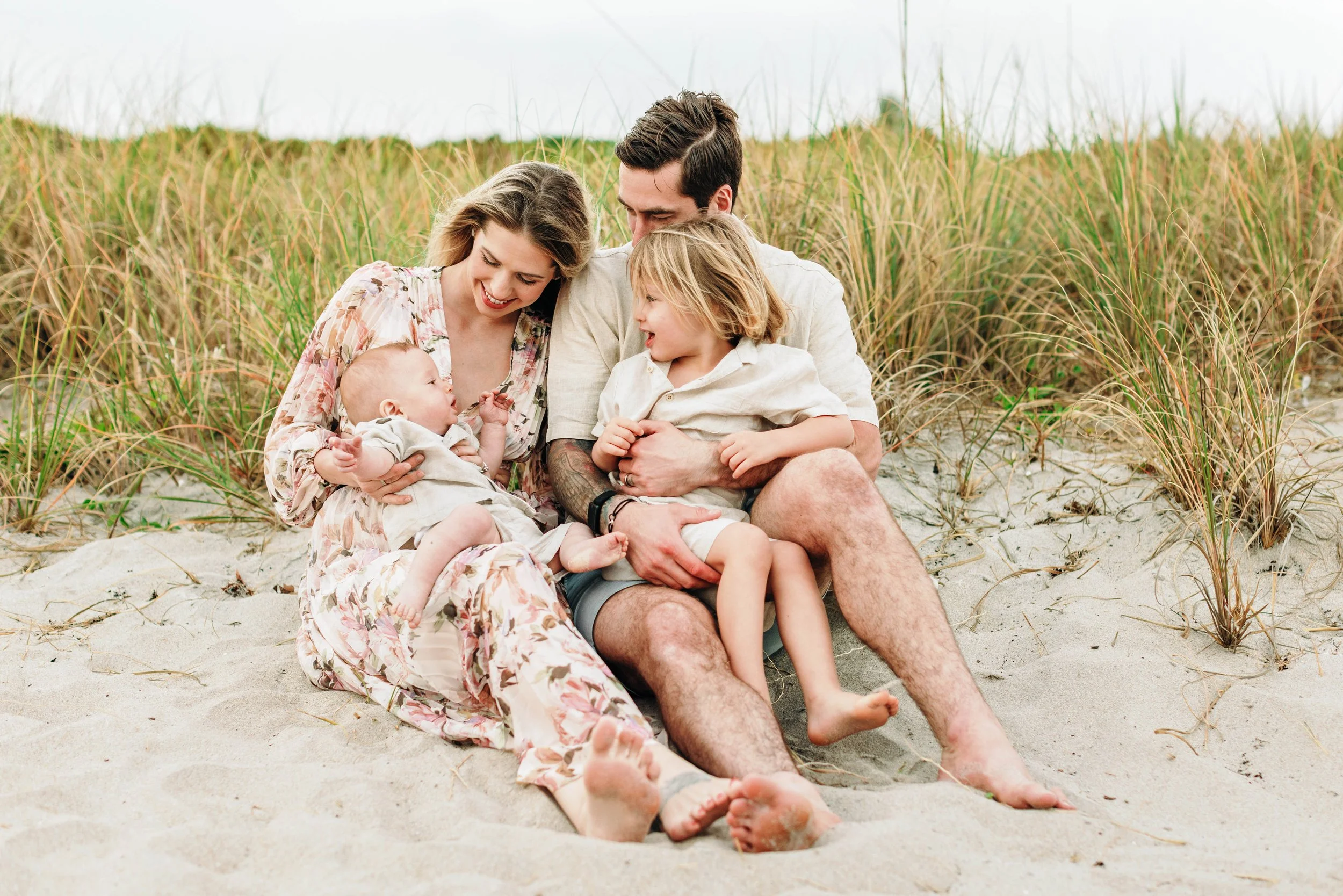 A candid moment of a family during a beach photography session in Delray Beach.