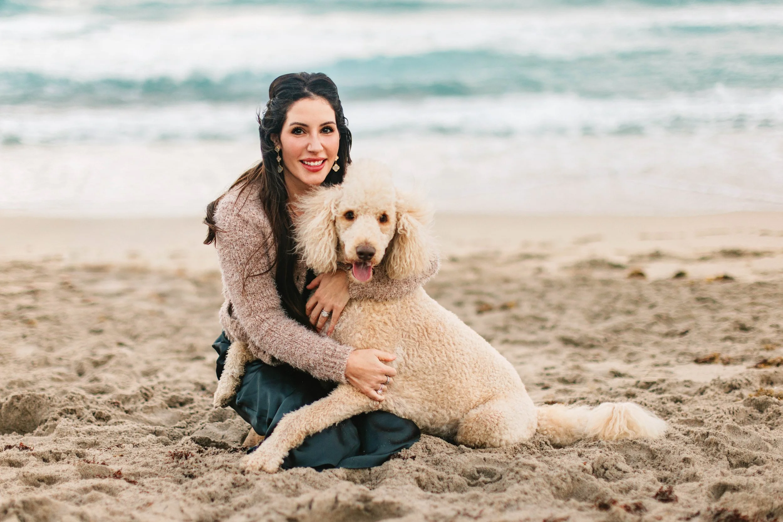 Family dog and mom on the beach during a family photography session in Delray Beach