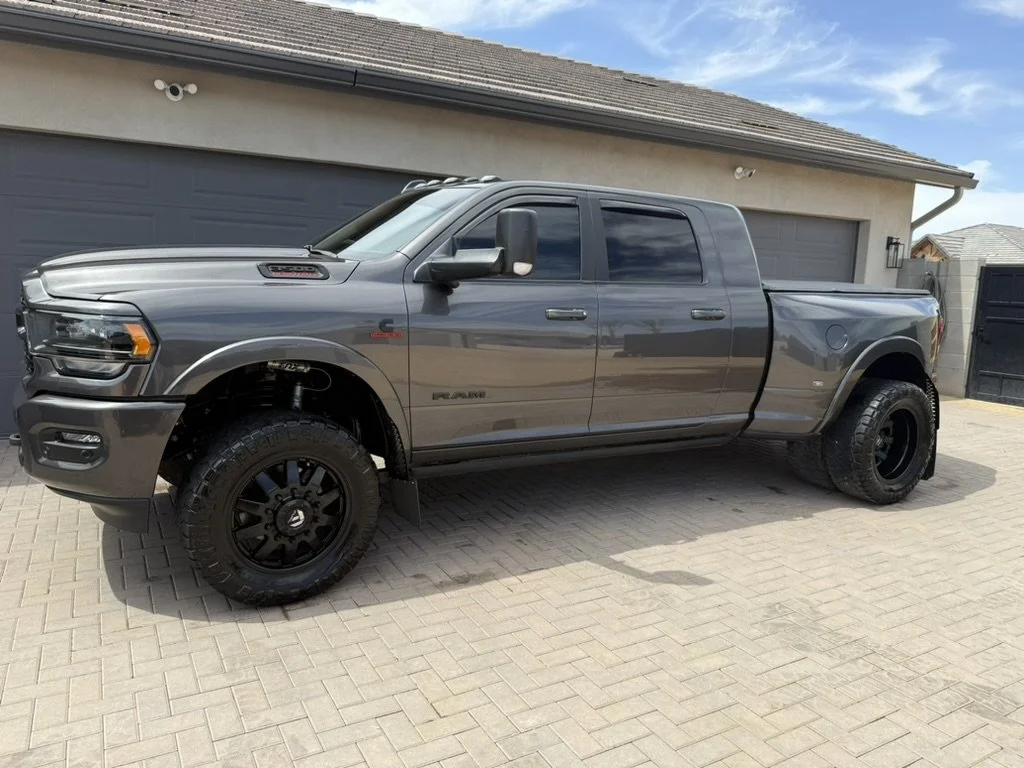 Ram 3500 Dually reflecting the background after receiving its transformation exterior detail in Peoria, AZ.