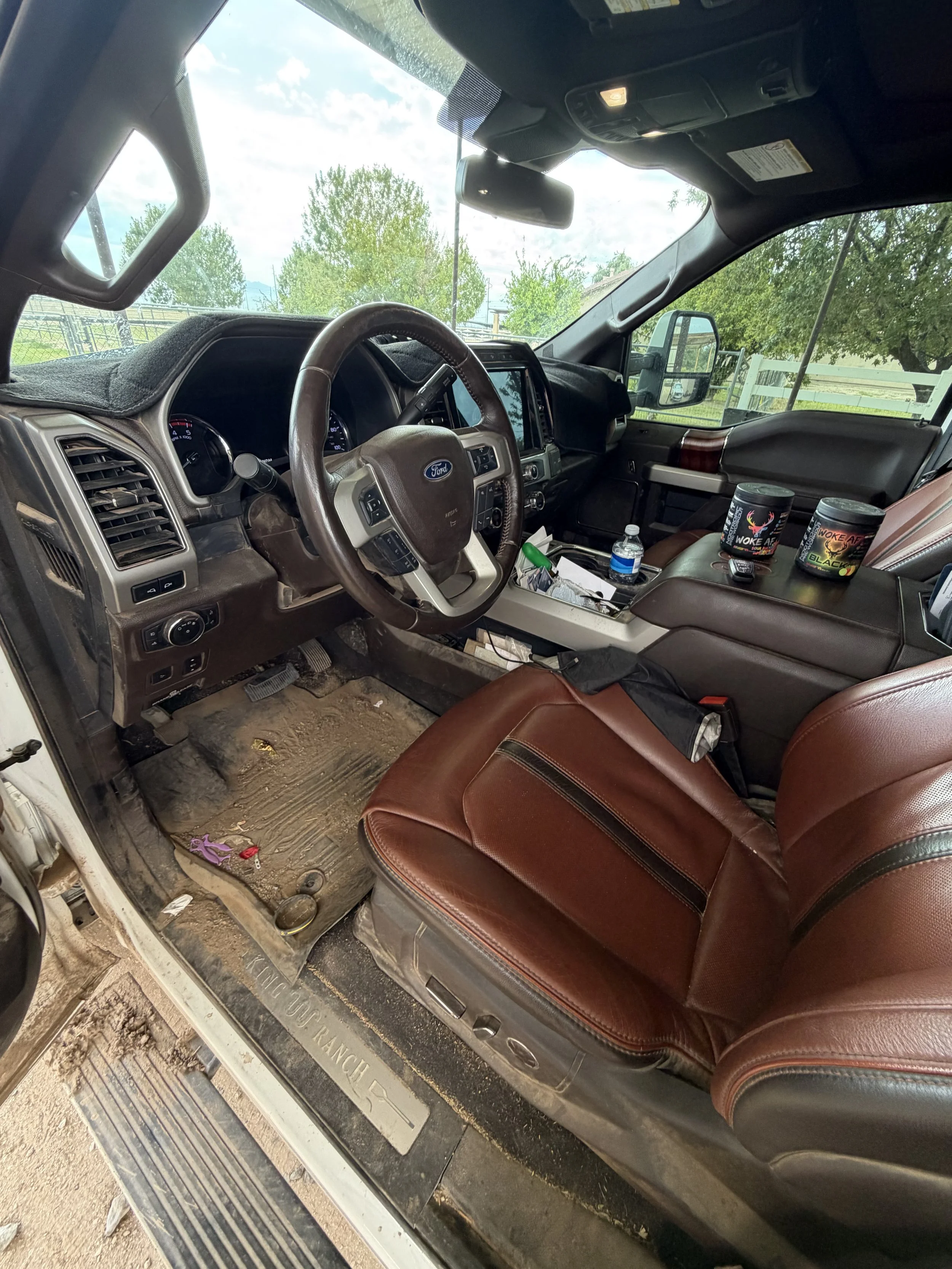 Interior of F250 before covered in dirt and grime before an interior detail in Buckeye, AZ.