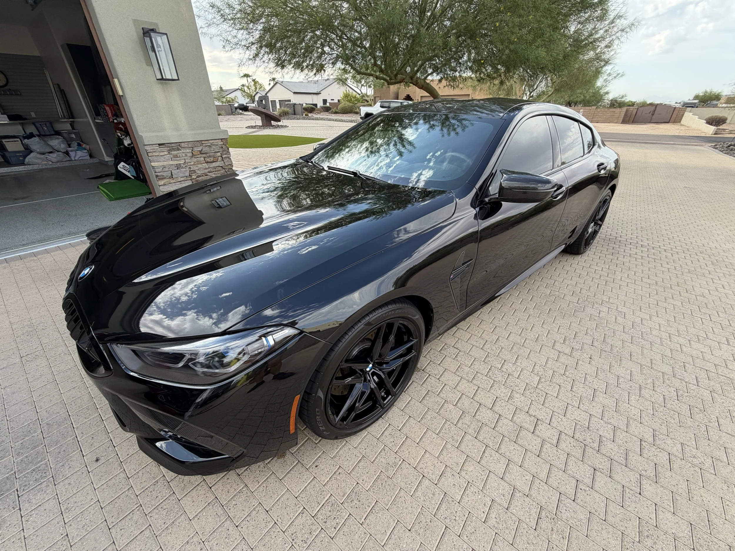 Mobile car maintenance detail on a black BMW M8 in North Phoenix AZ