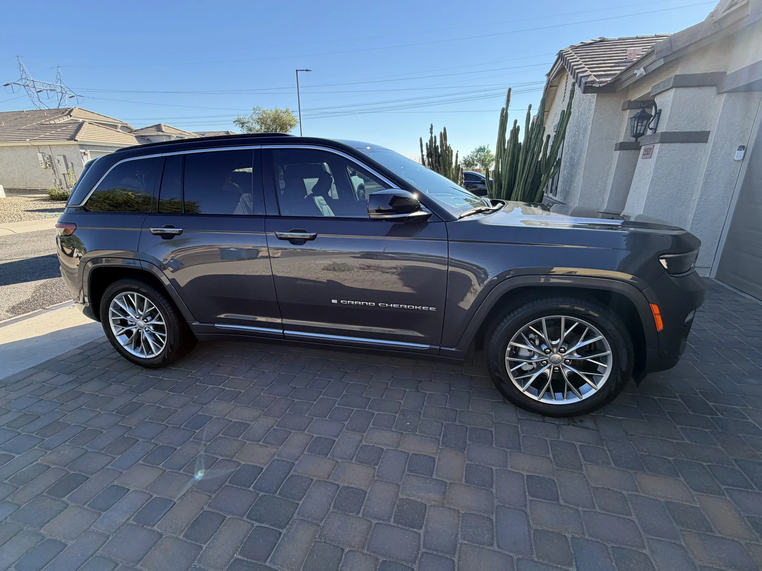 Jeep Grand Cherokee shining on the driveway following a a complete detail in Buckeye, AZ