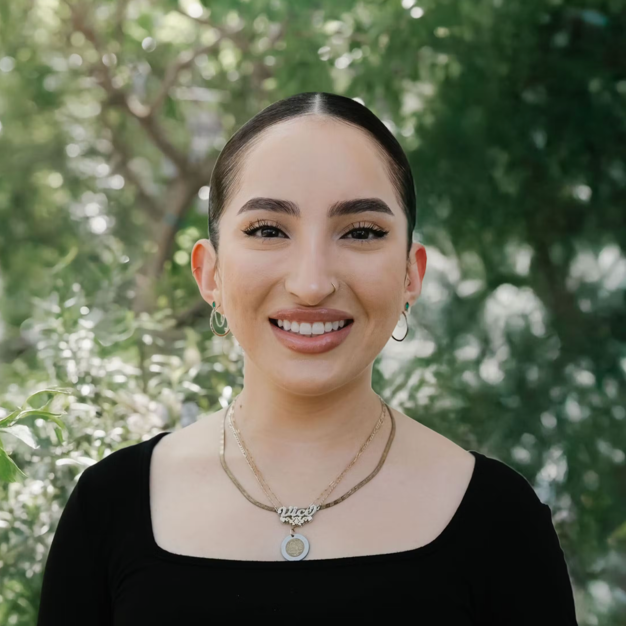 Sydney Reyes with a floral background