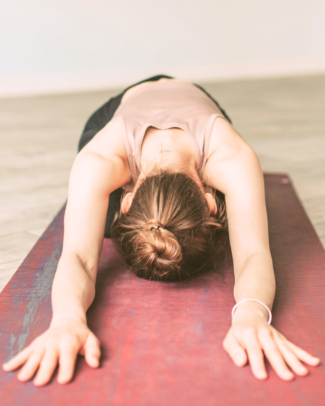 Woman doing yoga - childs pose