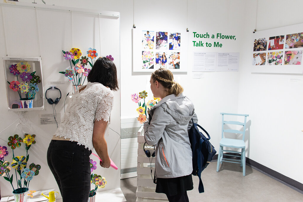 visitors to the exhibition talk to Marion