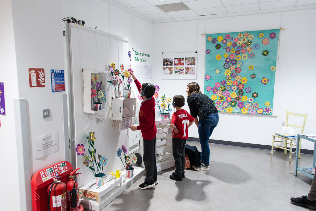 visitors test the displays