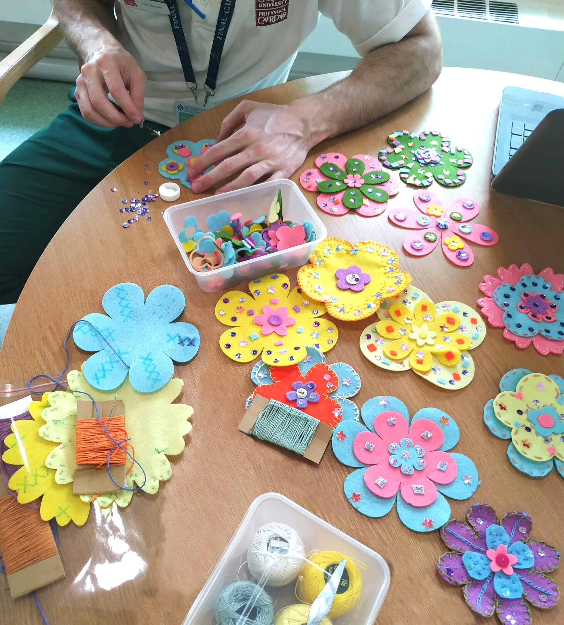 staff working in the dayroom making flower display