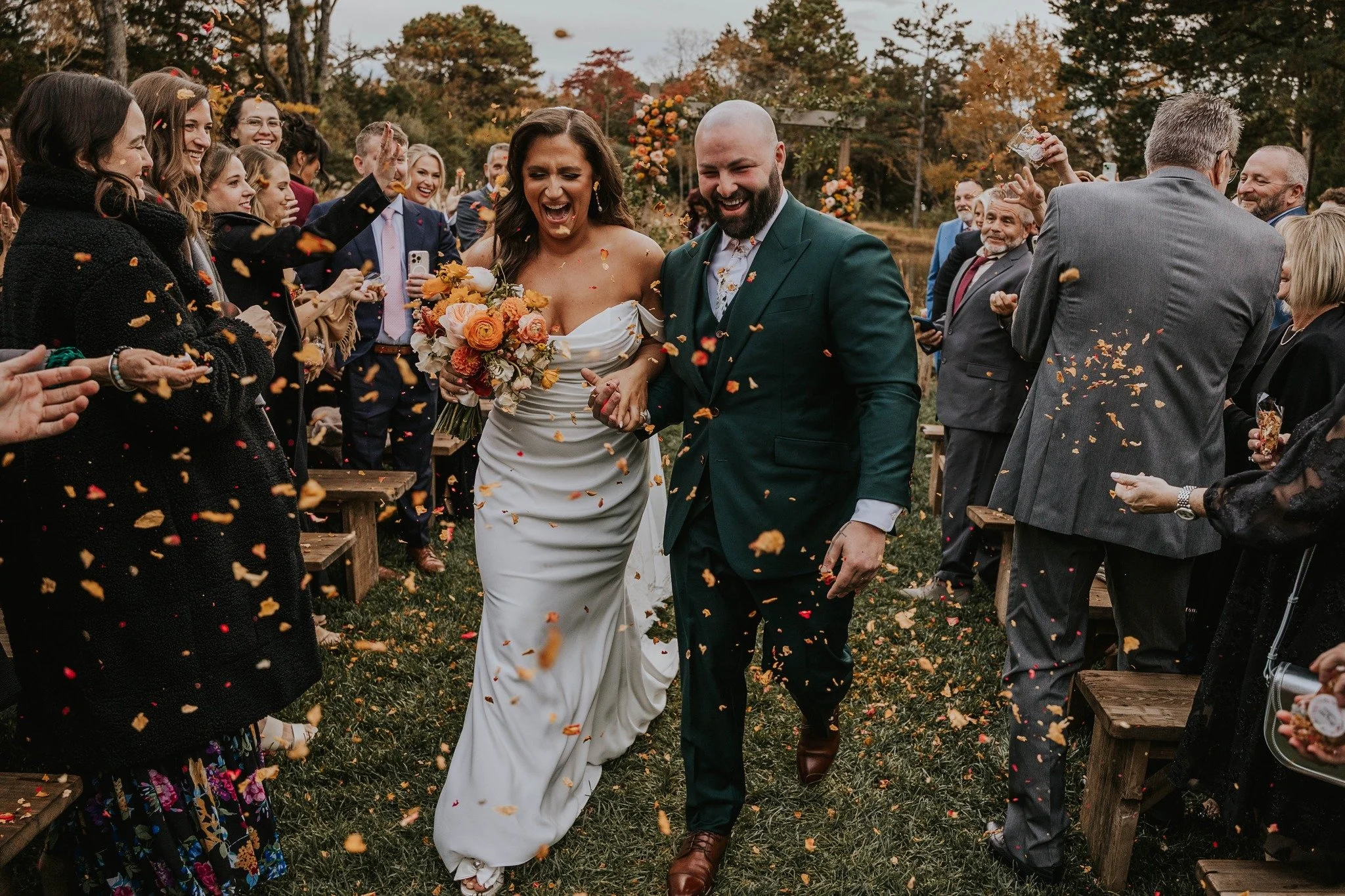 🌸 Always say yes to a petal toss! Cory and Dylan&rsquo;s walk back up the aisle turned into a full-blown fall confetti moment.

📸 Photographer | @nataliafries 
💐 Florist | @wildflowerfarmflorals 
👰🏻&zwj;♀️ Bride | @corwhit 
🤵🏻 Groom | @dylan_m