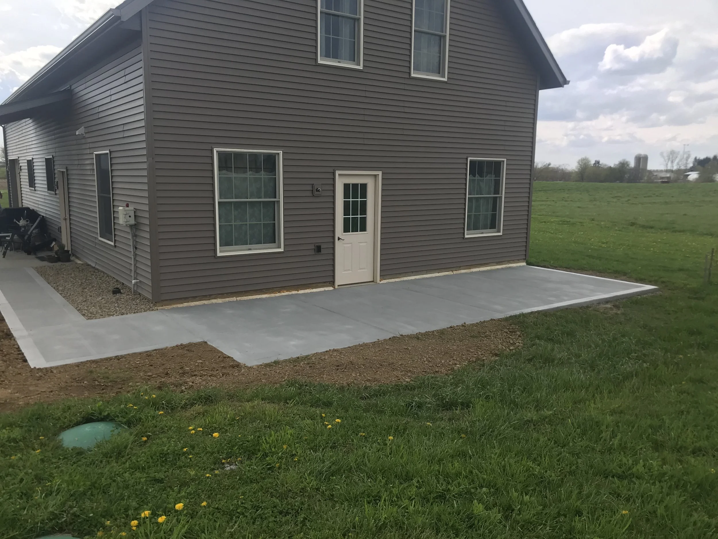concrete behind barn and sidewalk.jpg