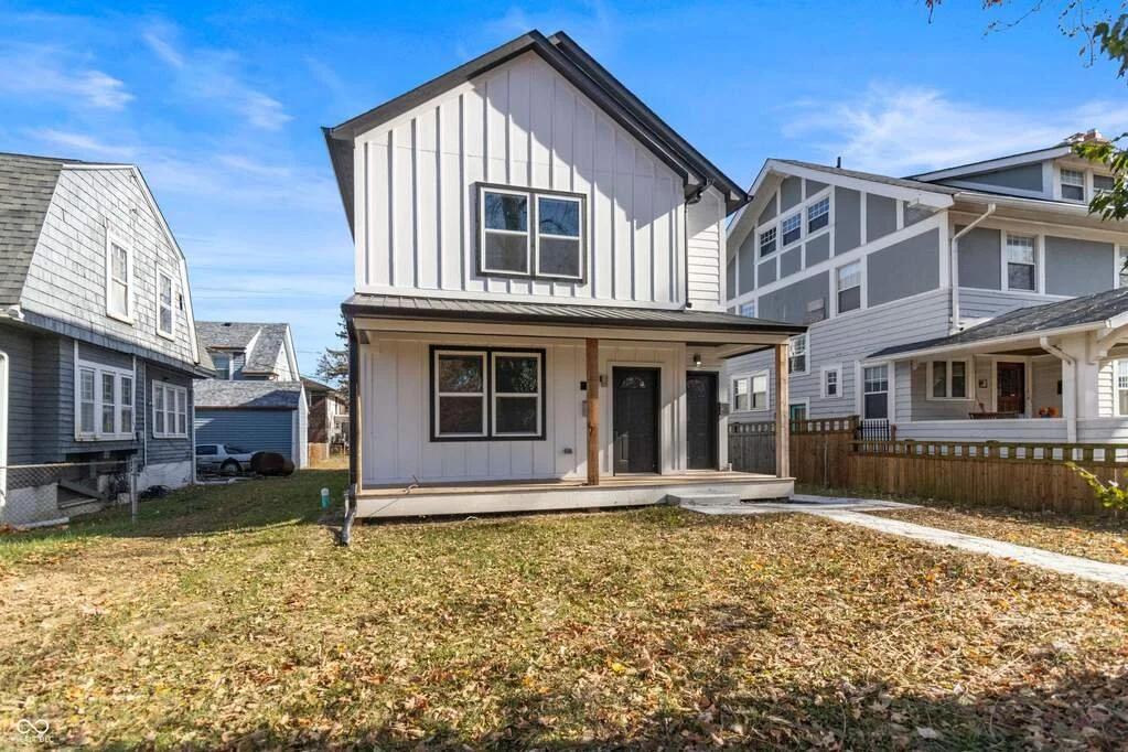 New construction 3-bedroom townhome with open layout, modern kitchen, and covered front porch.