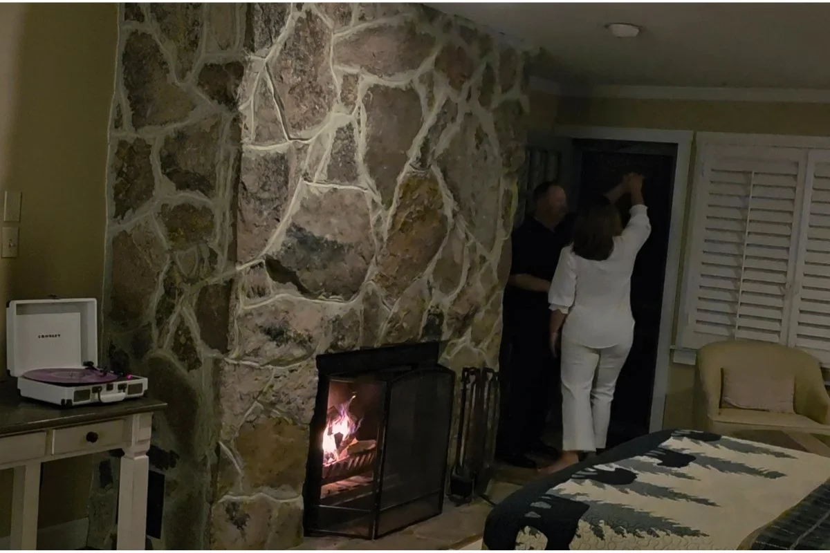 Leigh and Rich dancing together inside a cabin at Mountain Lake Lodge