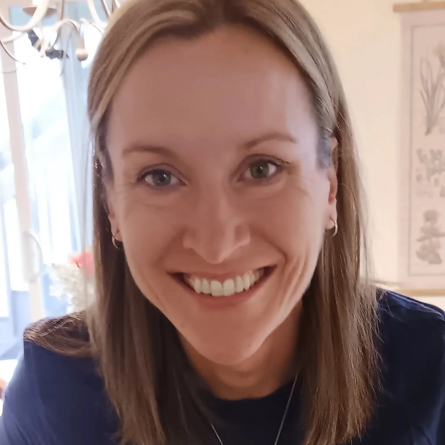 Karen is shown with long brown hair, hazel eyes, and wearing a purple top
