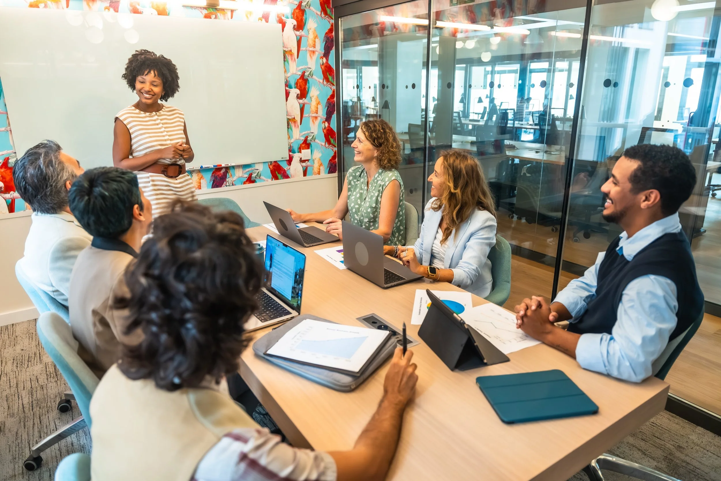 a group of people sitting around a conference table