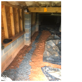Interior French drain trench installed in crawl space