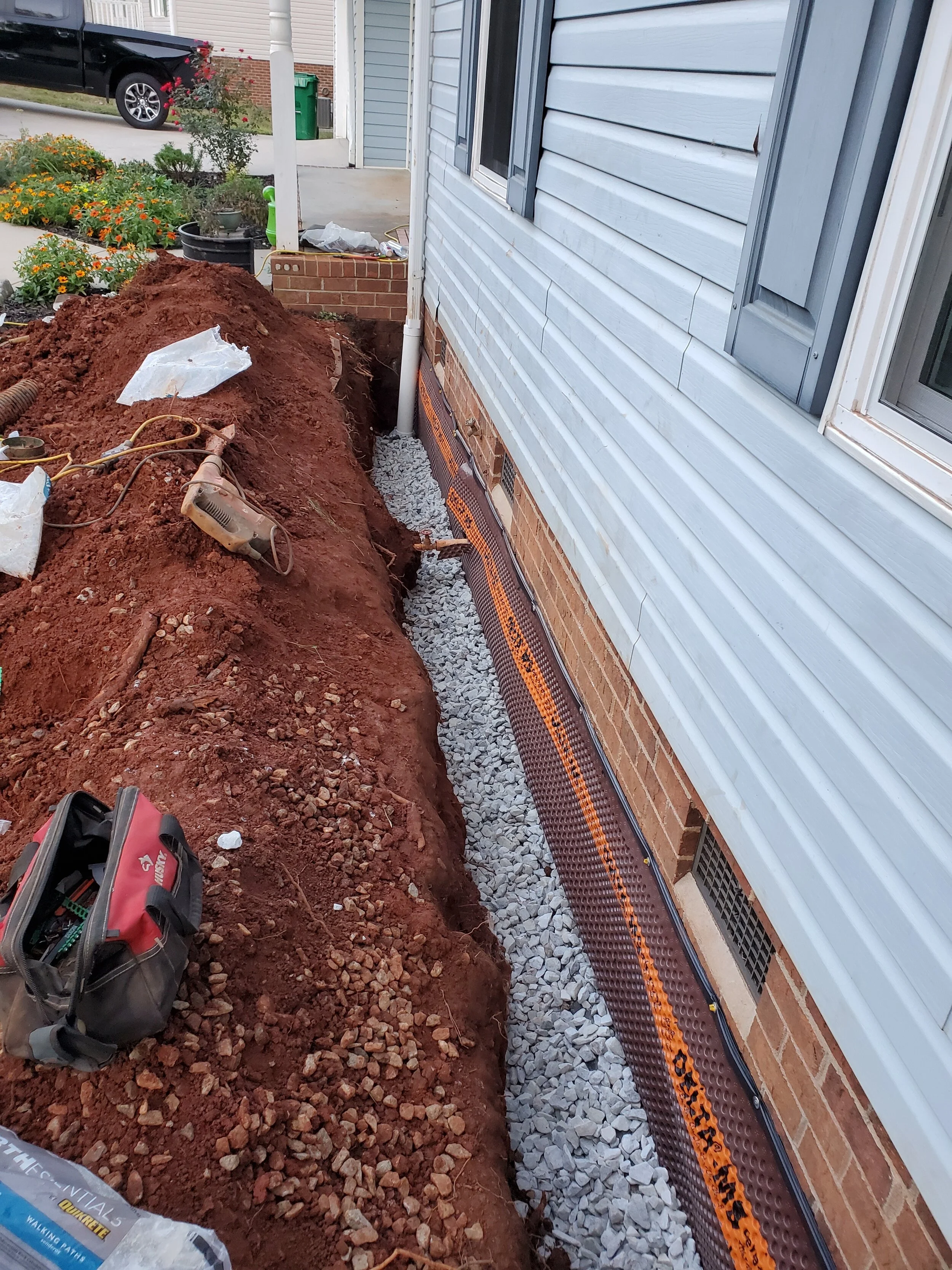 Exterior foundation drainage installation by Encapsulation Professionals