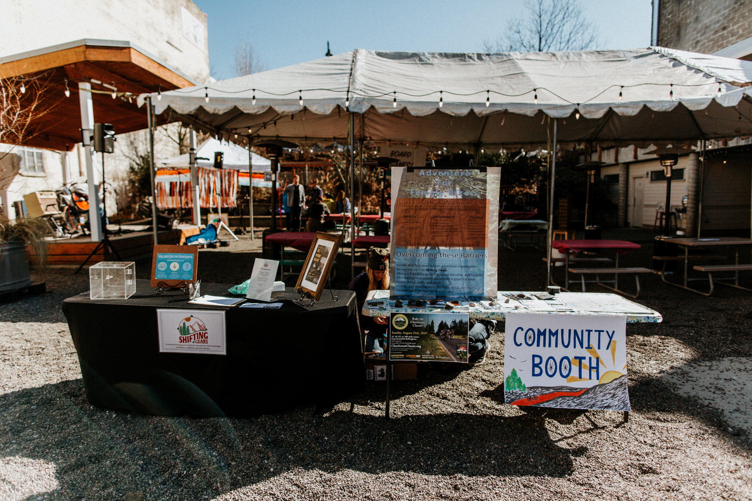 An image of the Community Booth in the Beer Garden at local Nonprofit Shifting Gears’ Bike Swap event