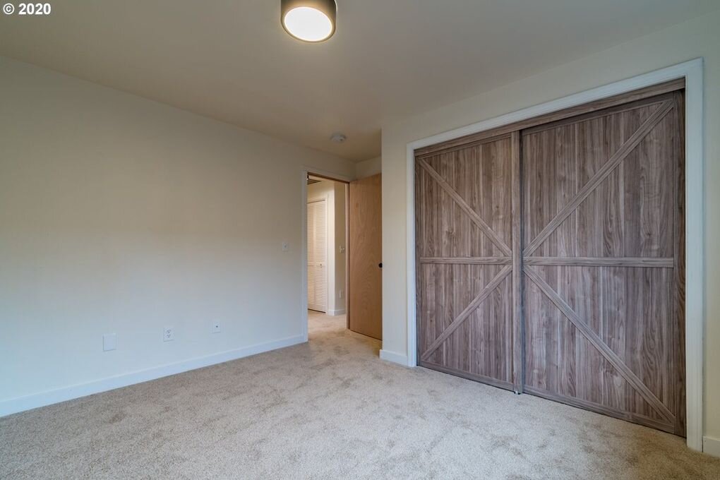 Contrasting design elements in bedrooms should be limited to one or two in properties listed for sale. Faux barn bypass doors are used in all three bedrooms here.