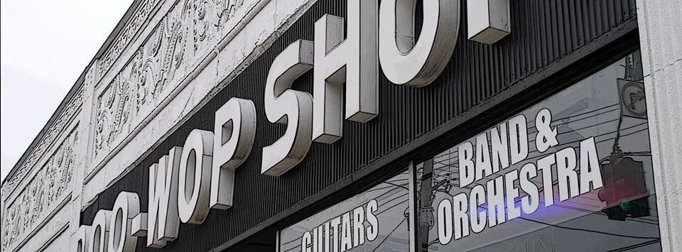 Doo Wop Shop's classic marquee at their original Bardstown Road location. Doo Wop rents P.A., lighting, guitars, drums, recording equipment, staging, and band and orchestra instruments.