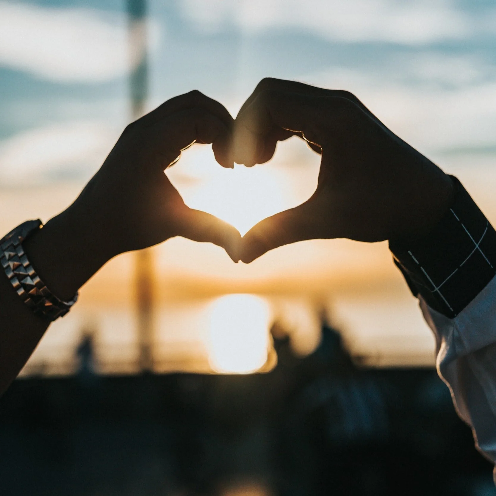Happy smiling woman with curly hair lounging on couch.