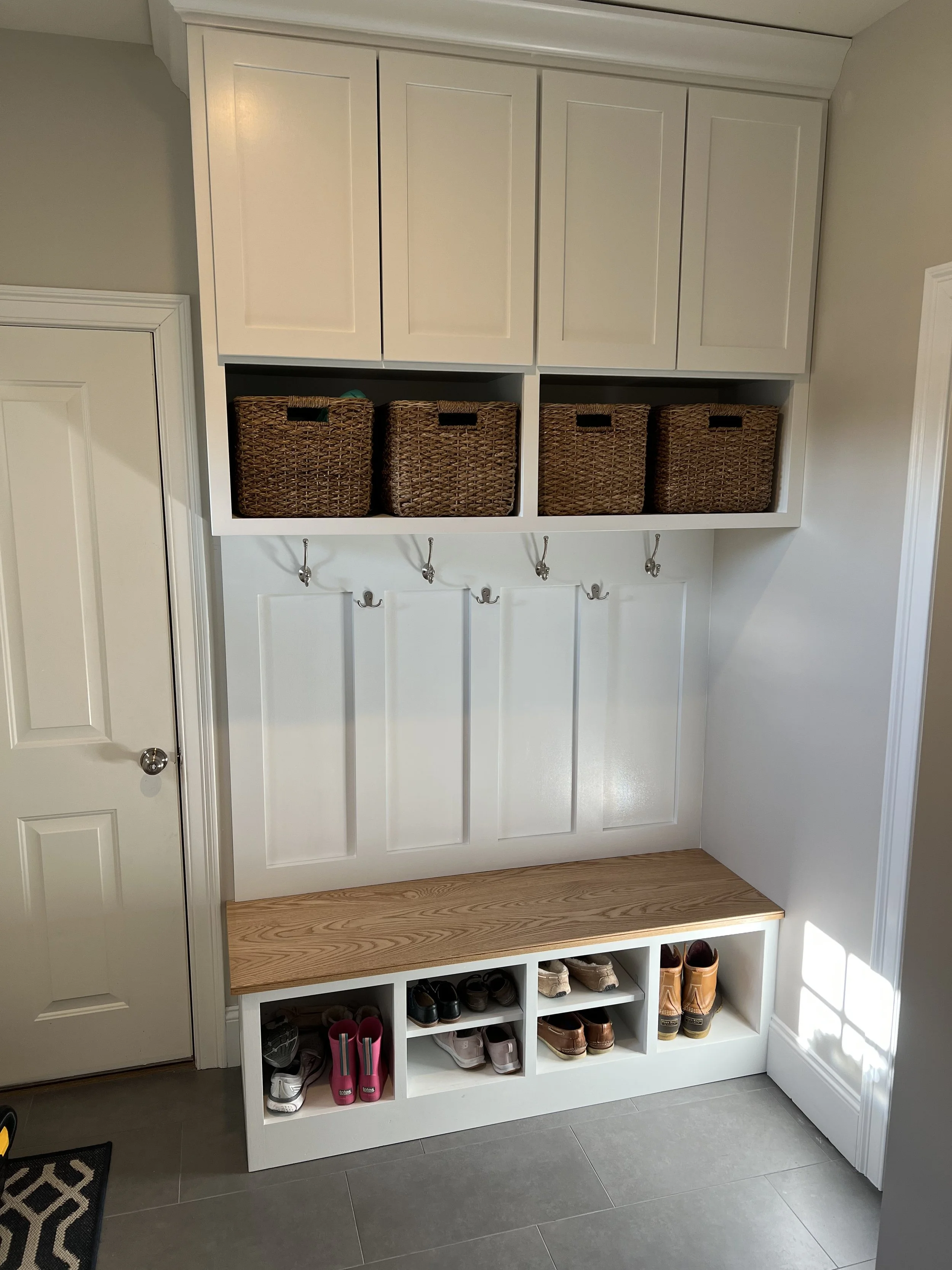Custom mudroom builtin cabinet and storage bench