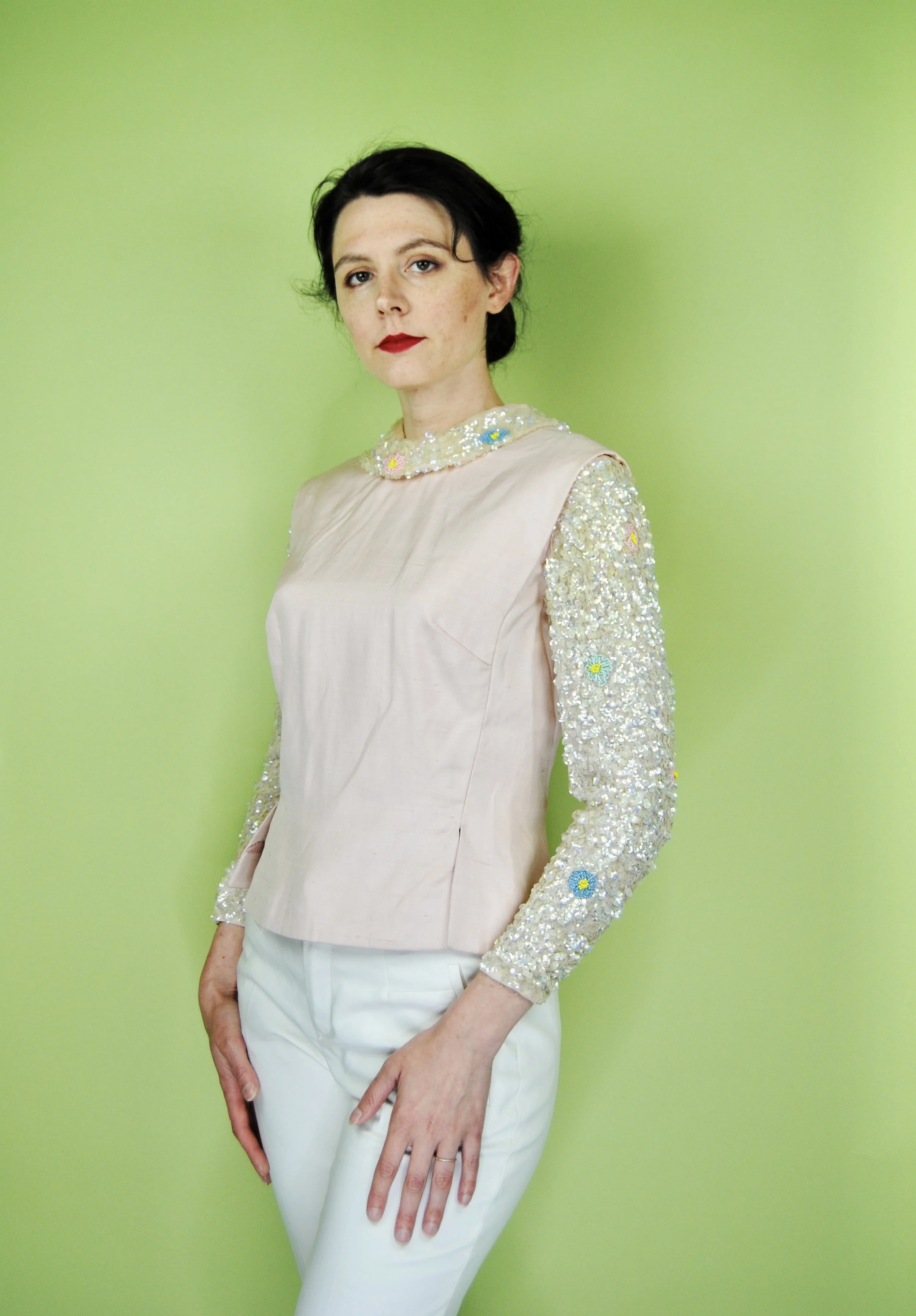 Sourced by my Mom, from whom I learned everything about this business. This absolutely lovely 1960s blouse was made by the exclusive "Needle Craft" and was created with such an eye for detail. My favorite feature - the chiffon sleeves, which featured