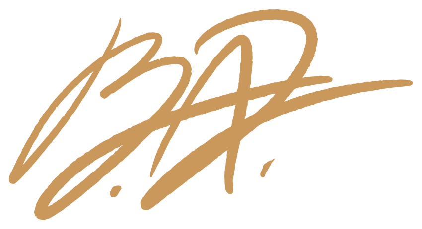 Stylized signature or autograph in gold color on black background.