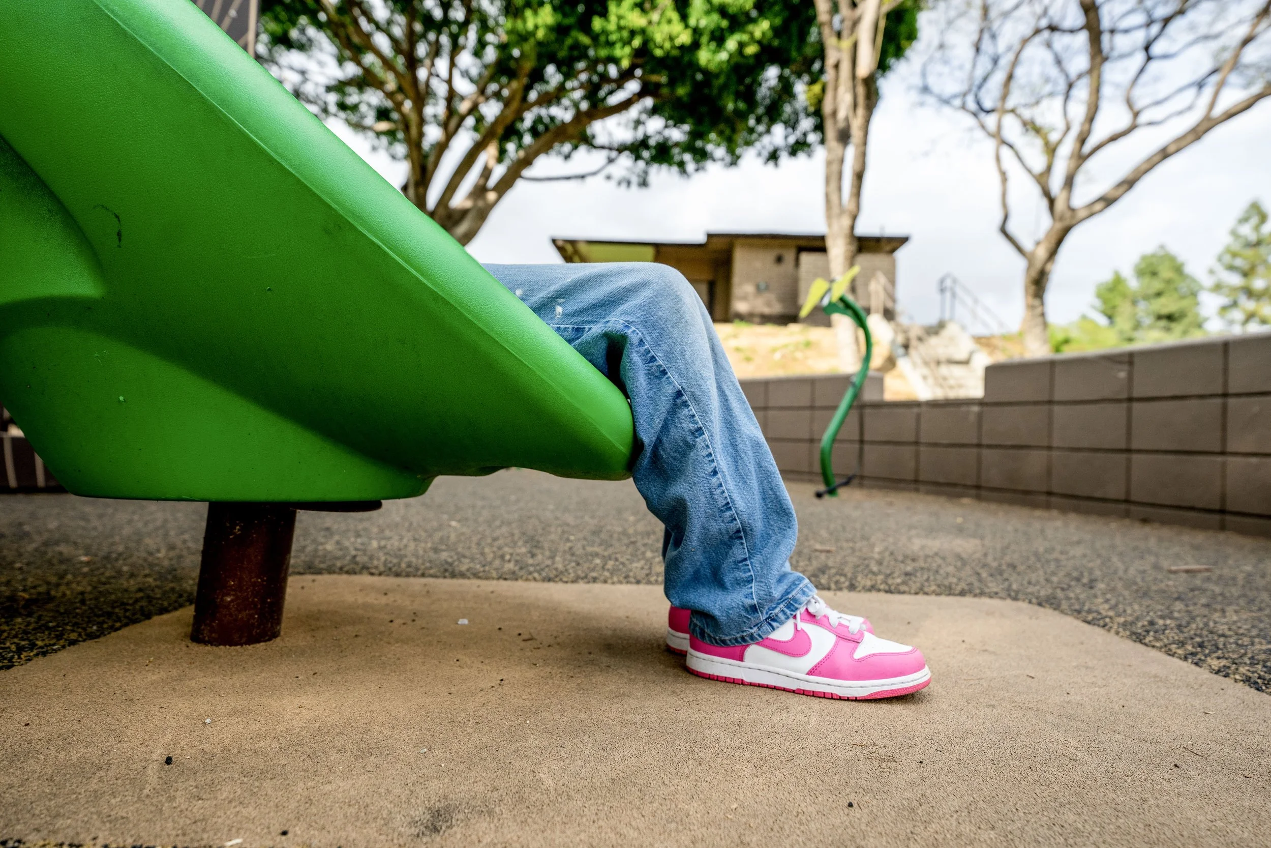 66commerical playground, girl sitting on slide, playground photography.jpg