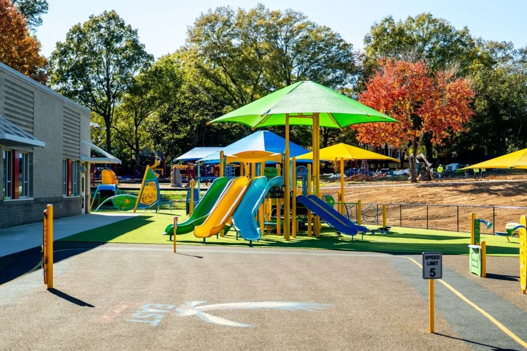 56colorful+playground%2C+commercial+playground%2C+playground+photography%2C+safety+surfacing%2C+triple+slide.jpg