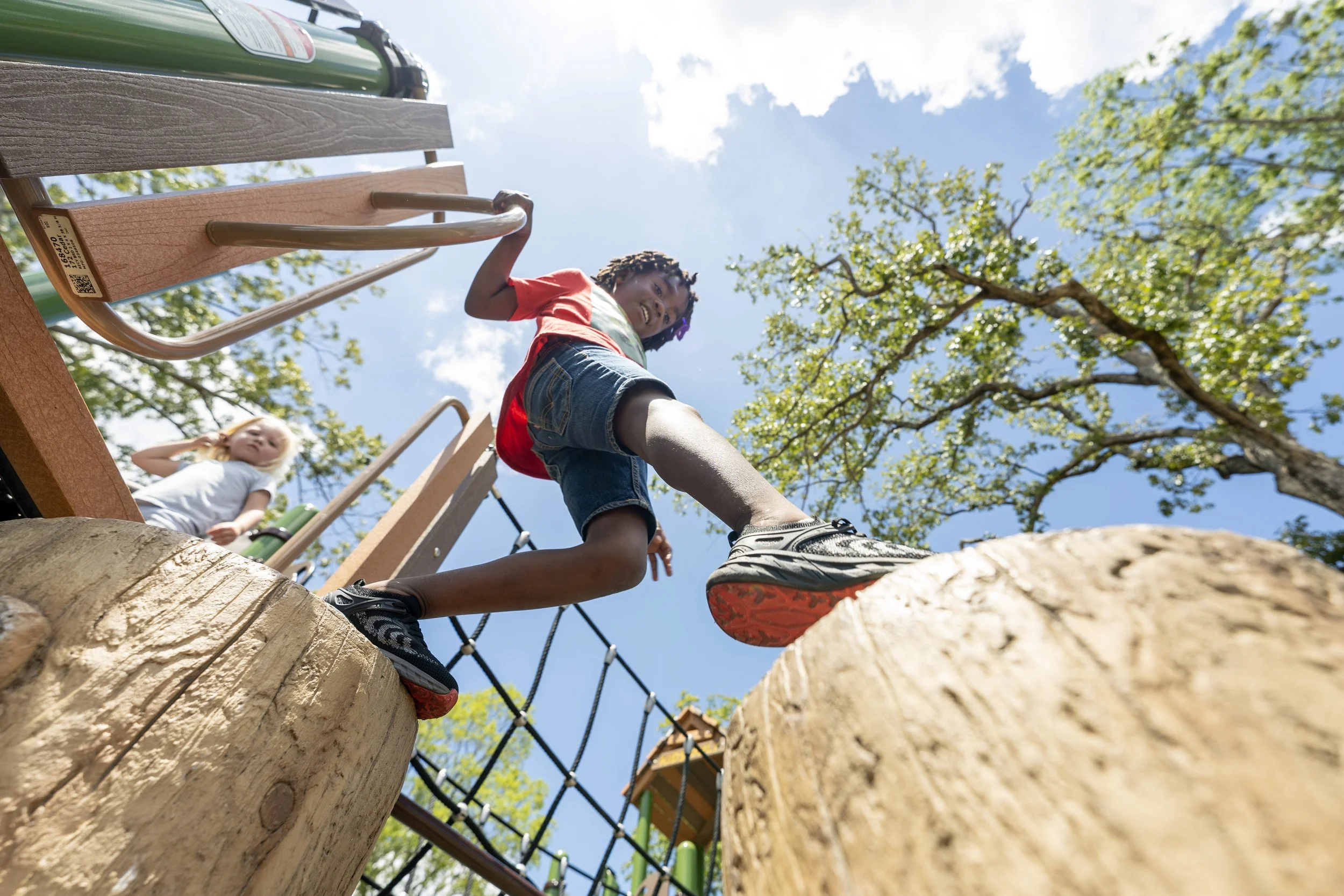 6boy playing on playground, concrete playground equipment, playground.jpg
