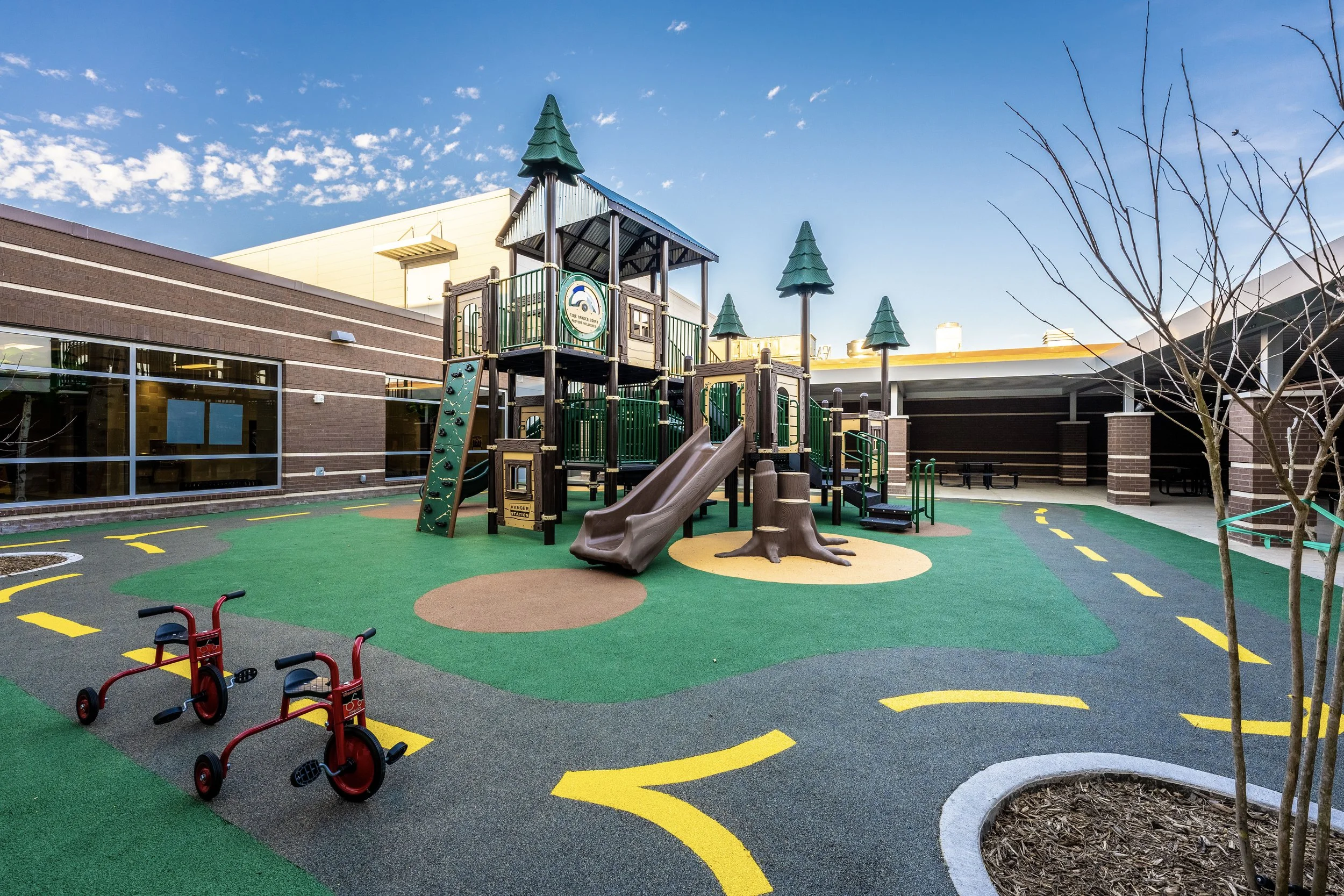 13climbing wall, playground, safety surfacing, slides, toy cars, trees.jpg